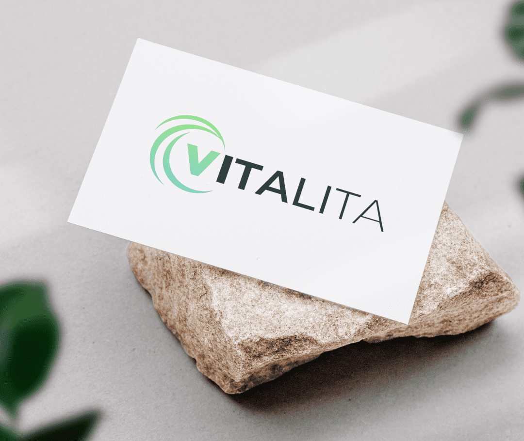 VITALITA visiting card on a stone